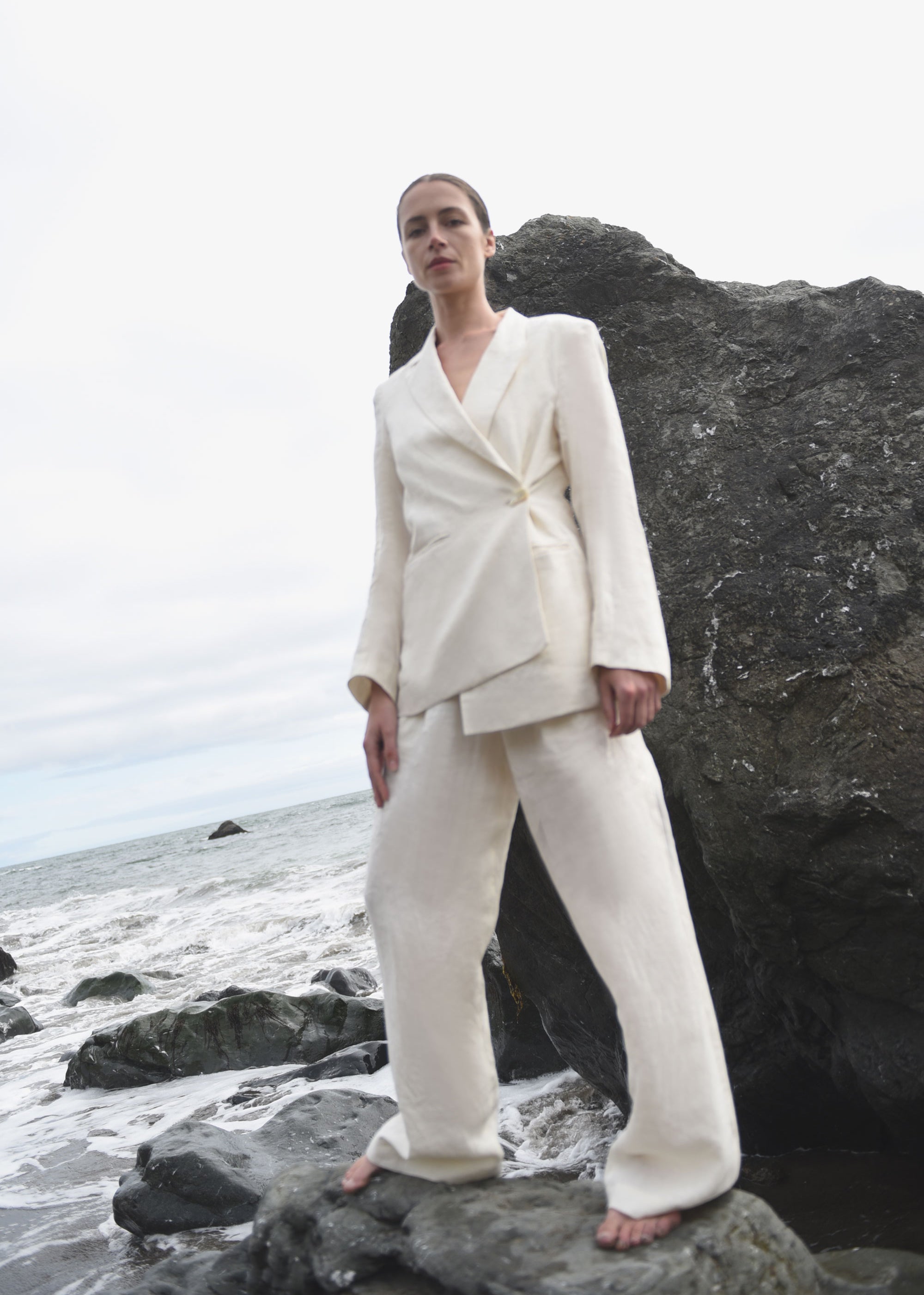 Back view of the ivory Japanese linen Kamperett Huene Pant showing the wide-leg silhouette.