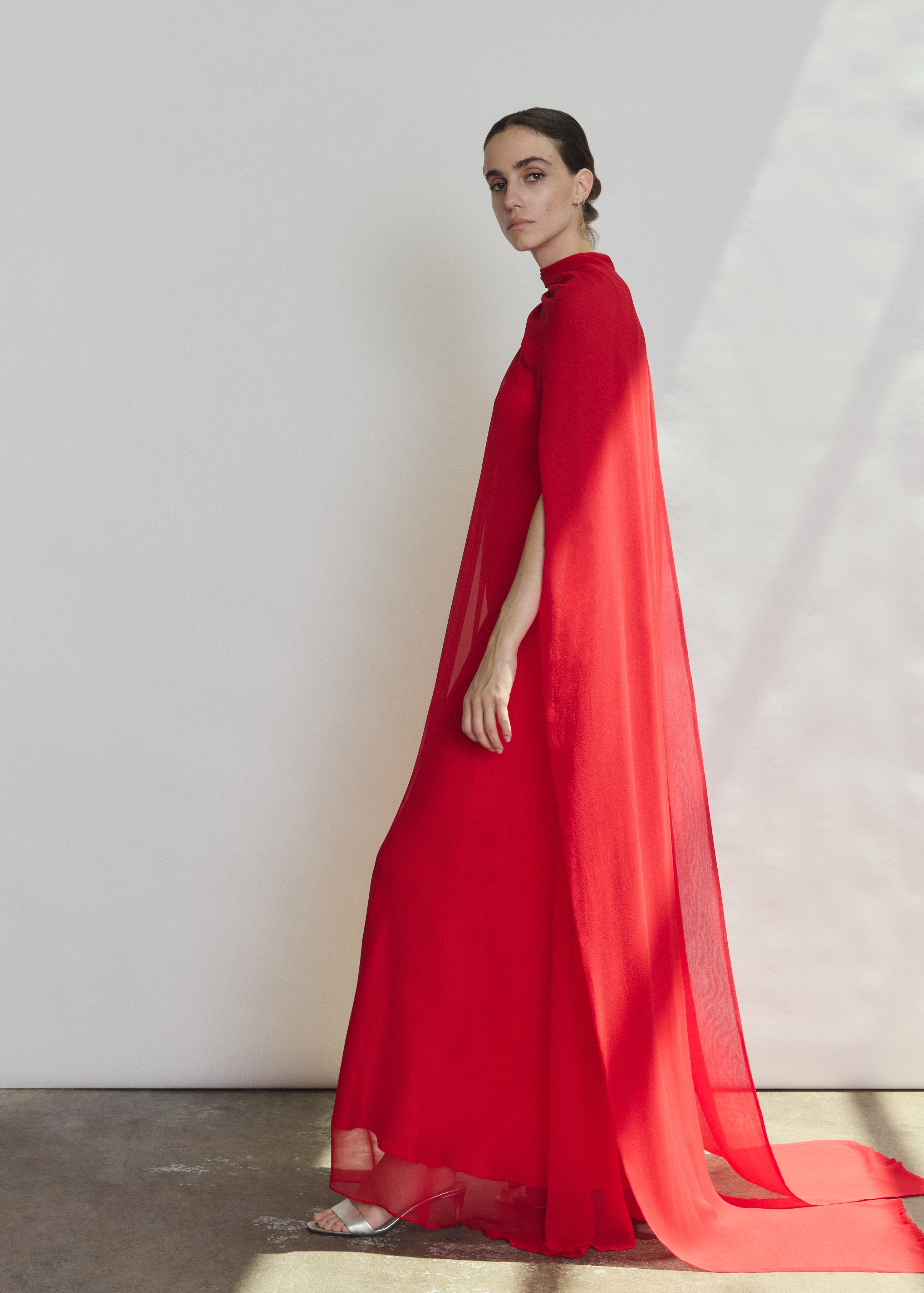 Back view of the crimson silk chiffon Kamperett Iris Gown showing the column silhouette.