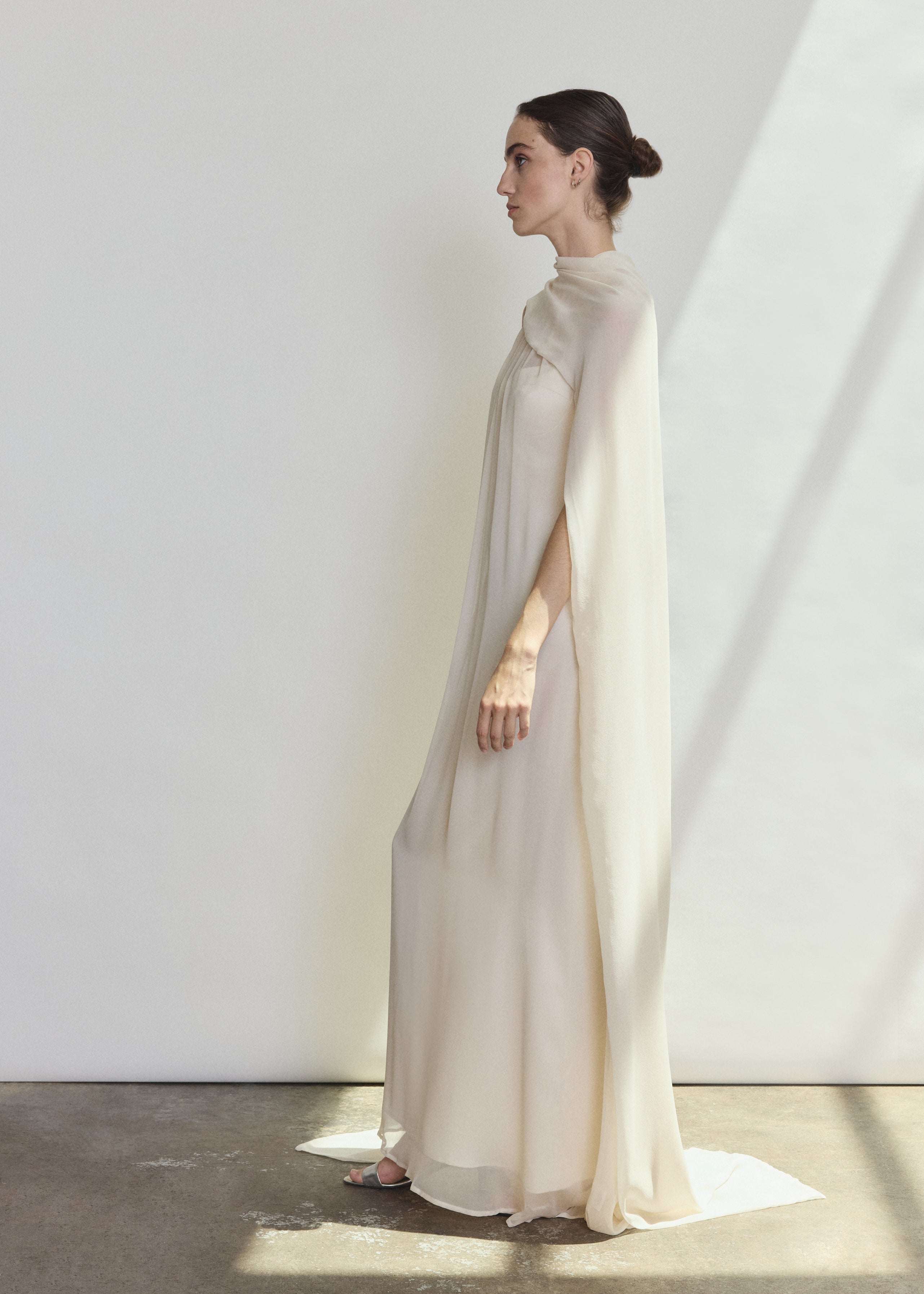 Detail of the ivory silk chiffon Kamperett Iris Gown showing the gathered neckline construction.