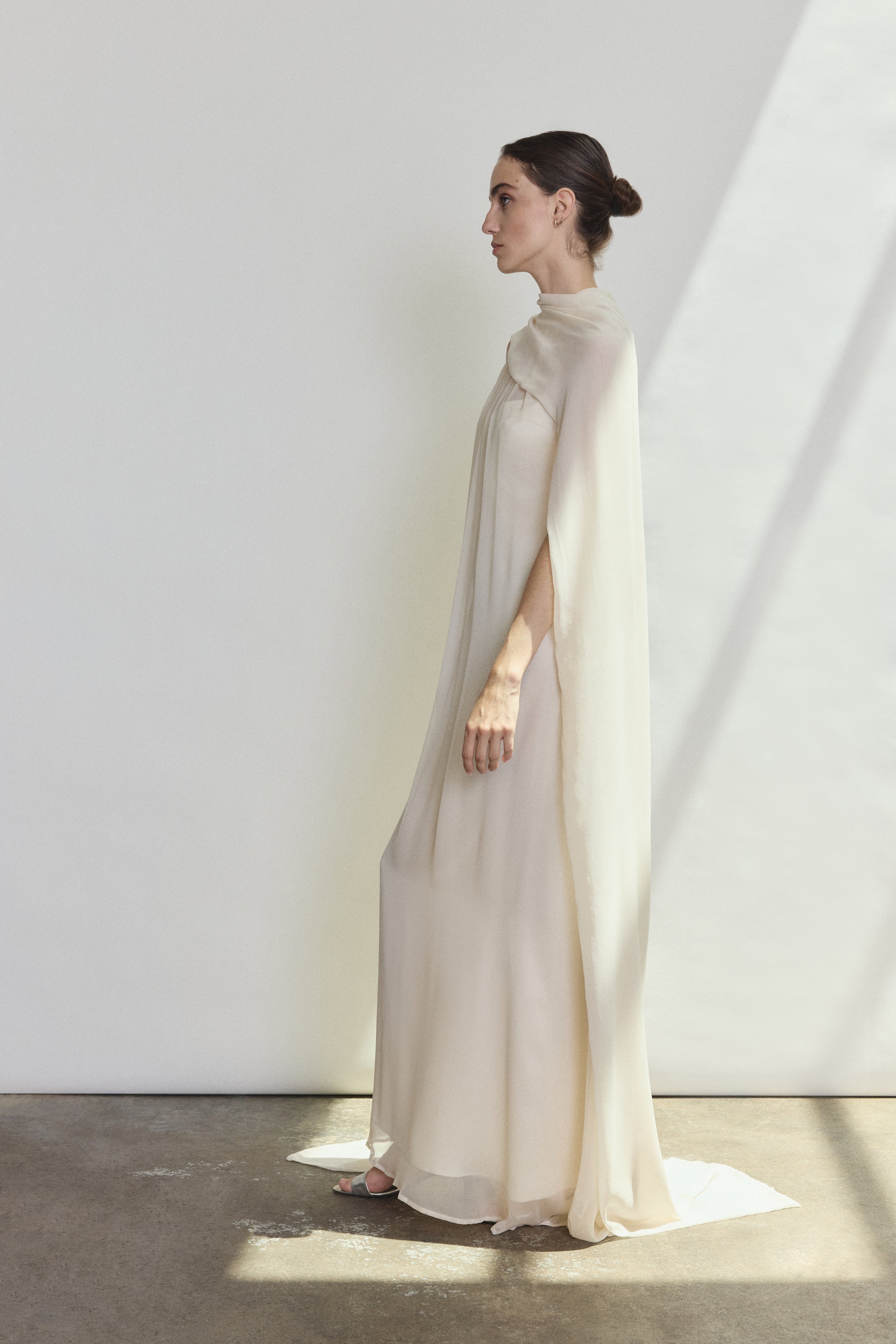 Detail of the ivory silk chiffon Kamperett Iris Gown showing the gathered neckline construction.