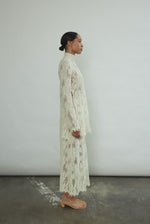 Detail of the eyelash French lace hem and contrast waist binding on the Kamperett Isabella Skirt in cream.