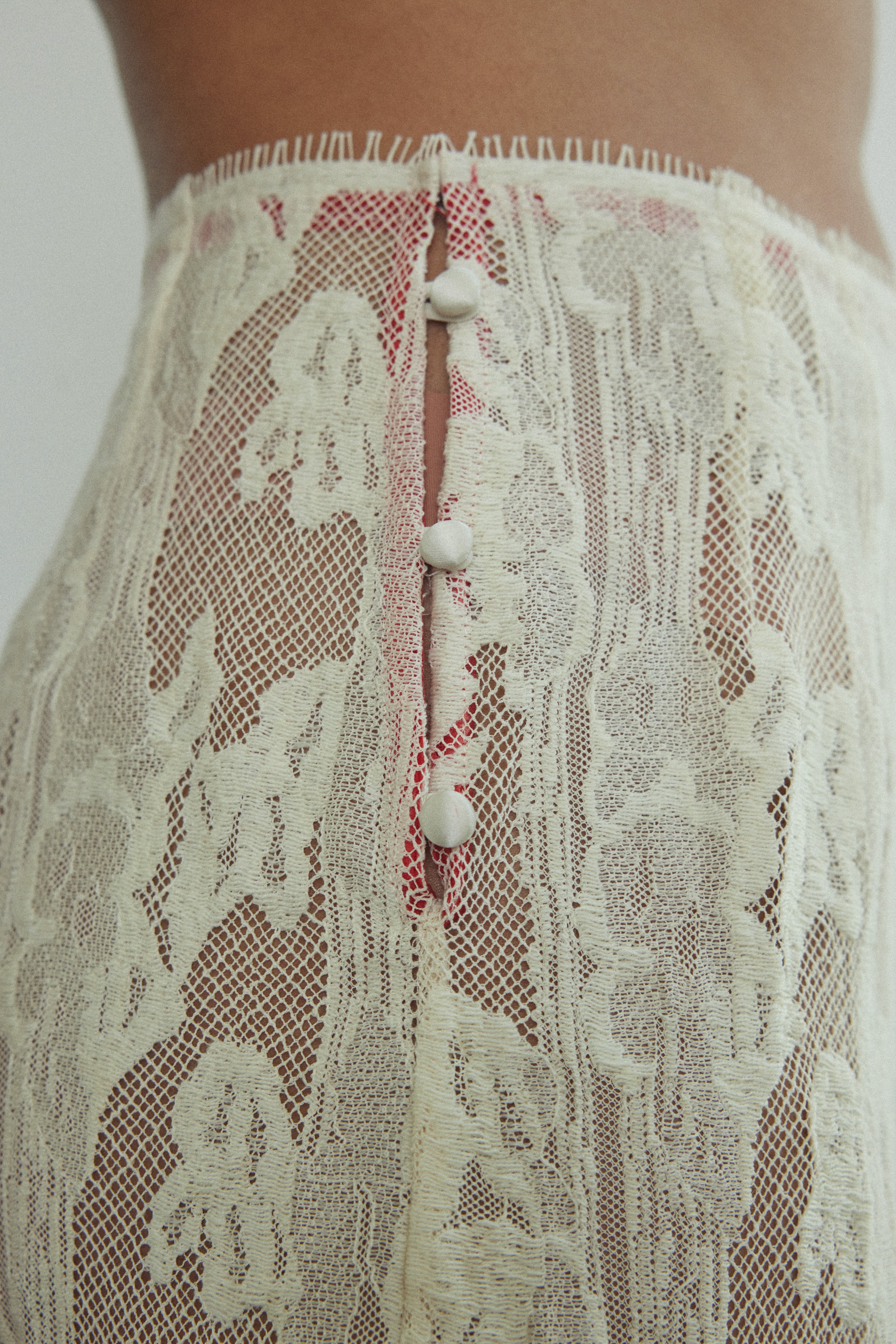 Motion shot of the cream French lace Kamperett Isabella Skirt showing the fluid movement of the eyelash lace hem.