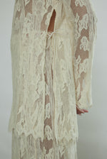 Kamperett Isabella Tunic in cream French lace, editorial close-up of side ties.