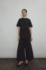 The black Kamperett Jette Cotton Tee styled with the Alix Pant for a modern minimalist look.