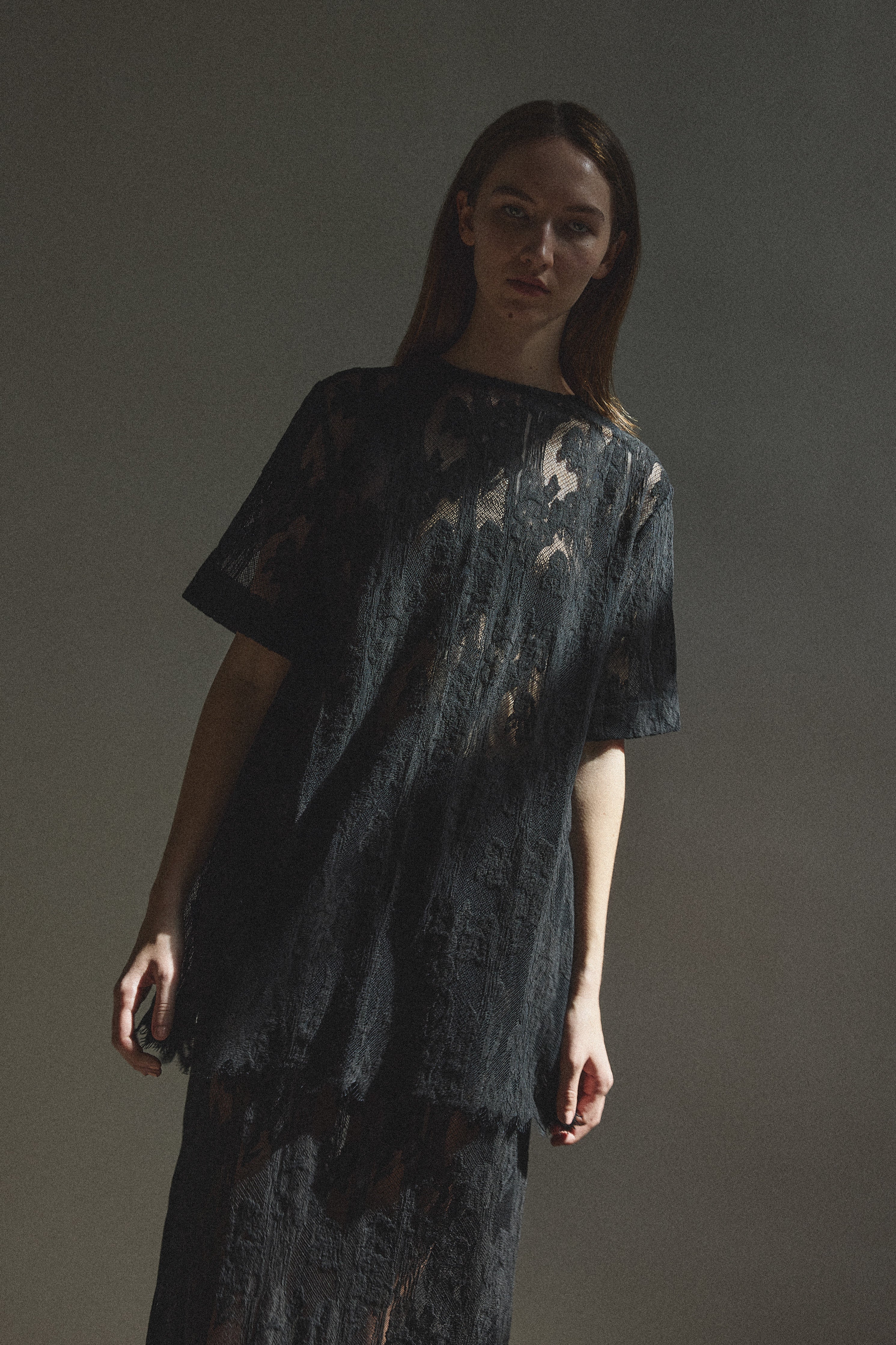 Alternate editorial image of the black French lace Kamperett Jette Tee.
