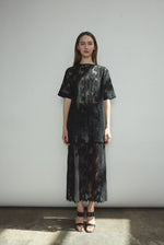 Front view of a model wearing the black French lace Kamperett Jette Tee with wide button placket and shoulder darts.