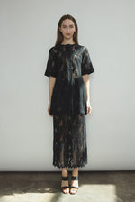 Side view of the black French lace Kamperett Jette Tee styled with the Huene Pant.