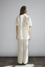 Back view of the cream French lace Kamperett Jette Tee showing the reversible construction with shoulder darts.