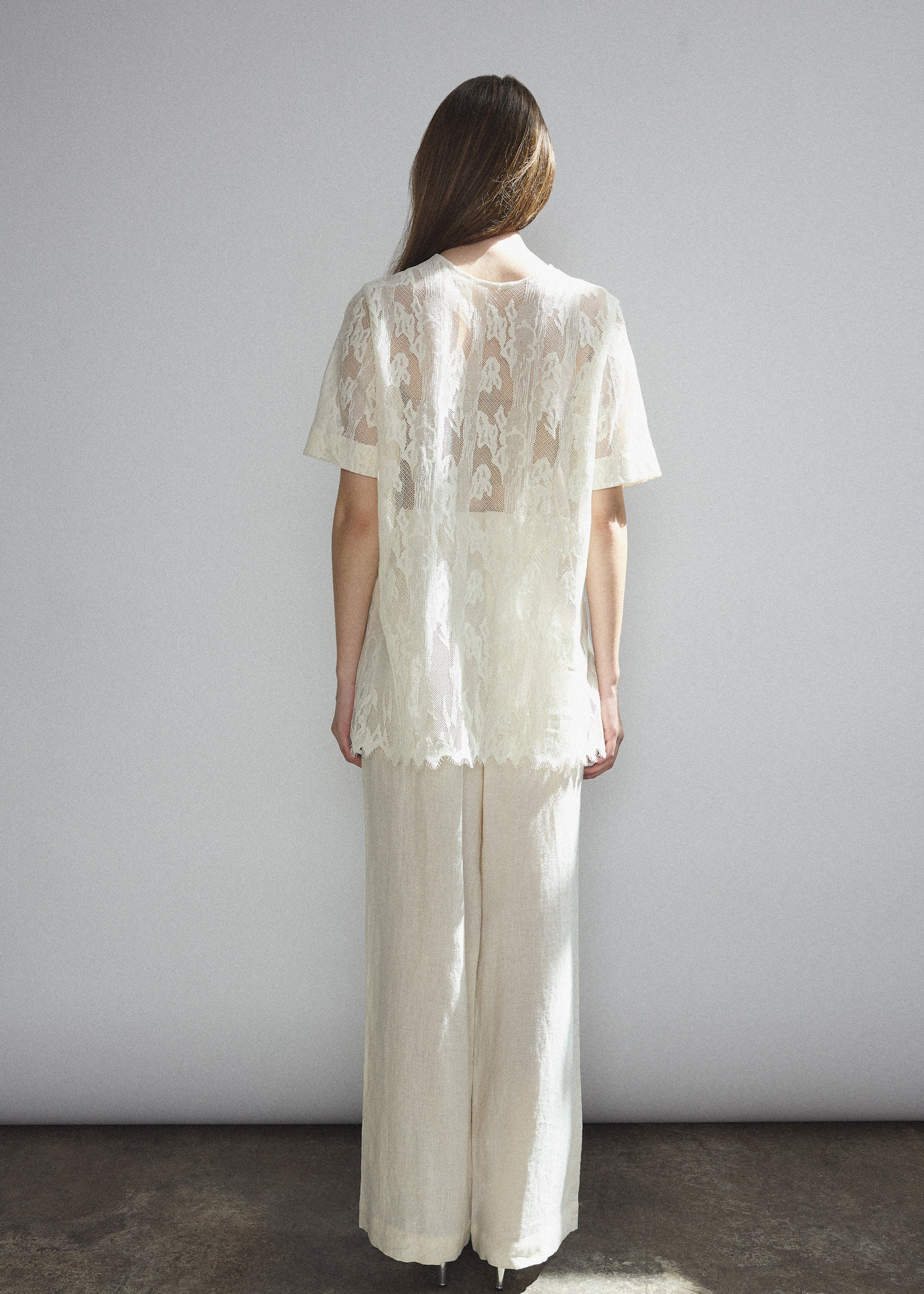 Back view of the cream French lace Kamperett Jette Tee showing the reversible construction with shoulder darts.