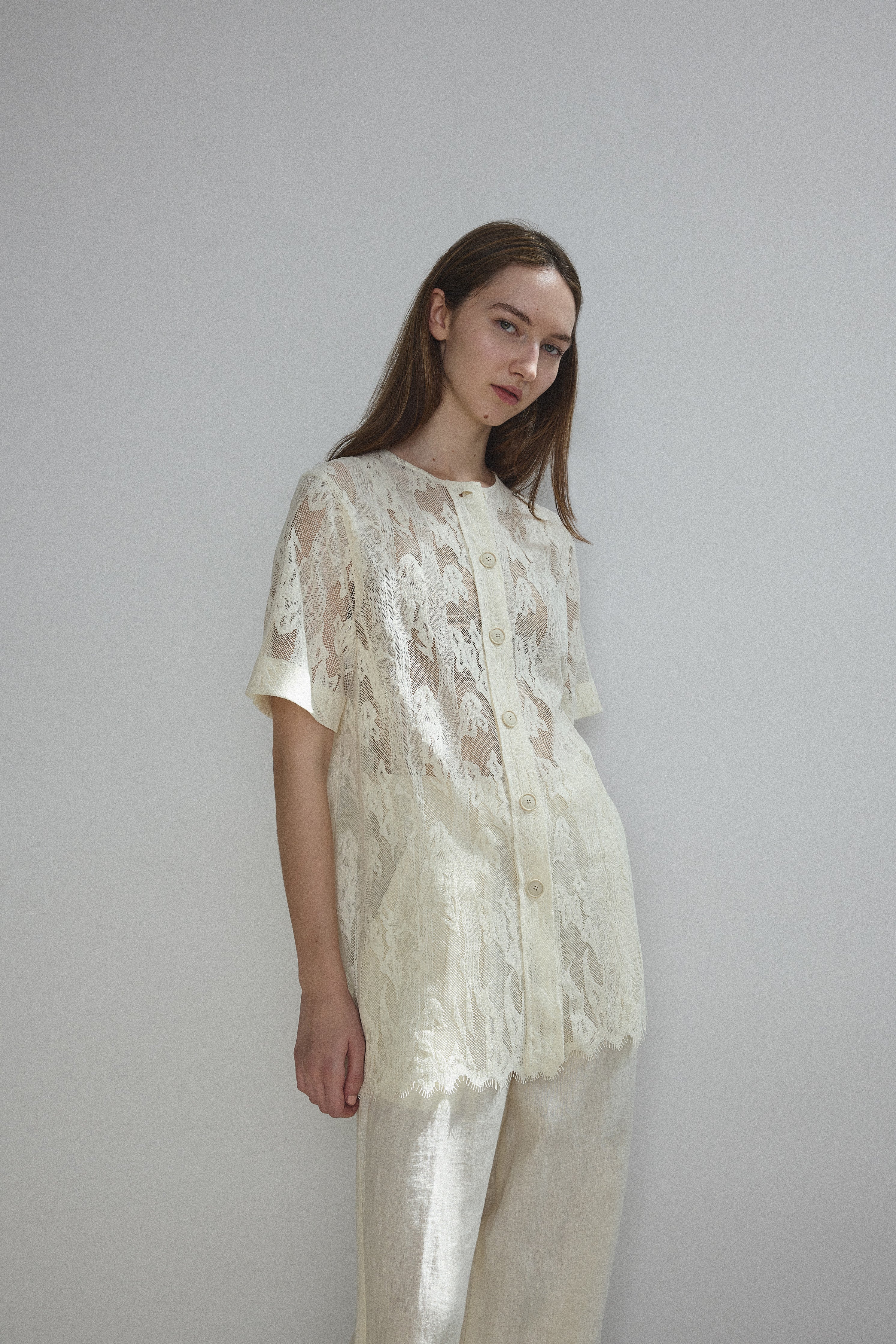 Alternate front view of the cream French lace Kamperett Jette Tee.