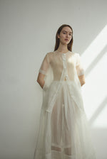Detail of the wide button placket on the alabaster silk organza Kamperett Jette Tee.
