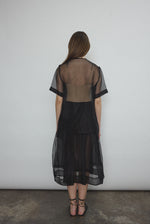 Angled view of the black silk organza Kamperett Jette Tee.