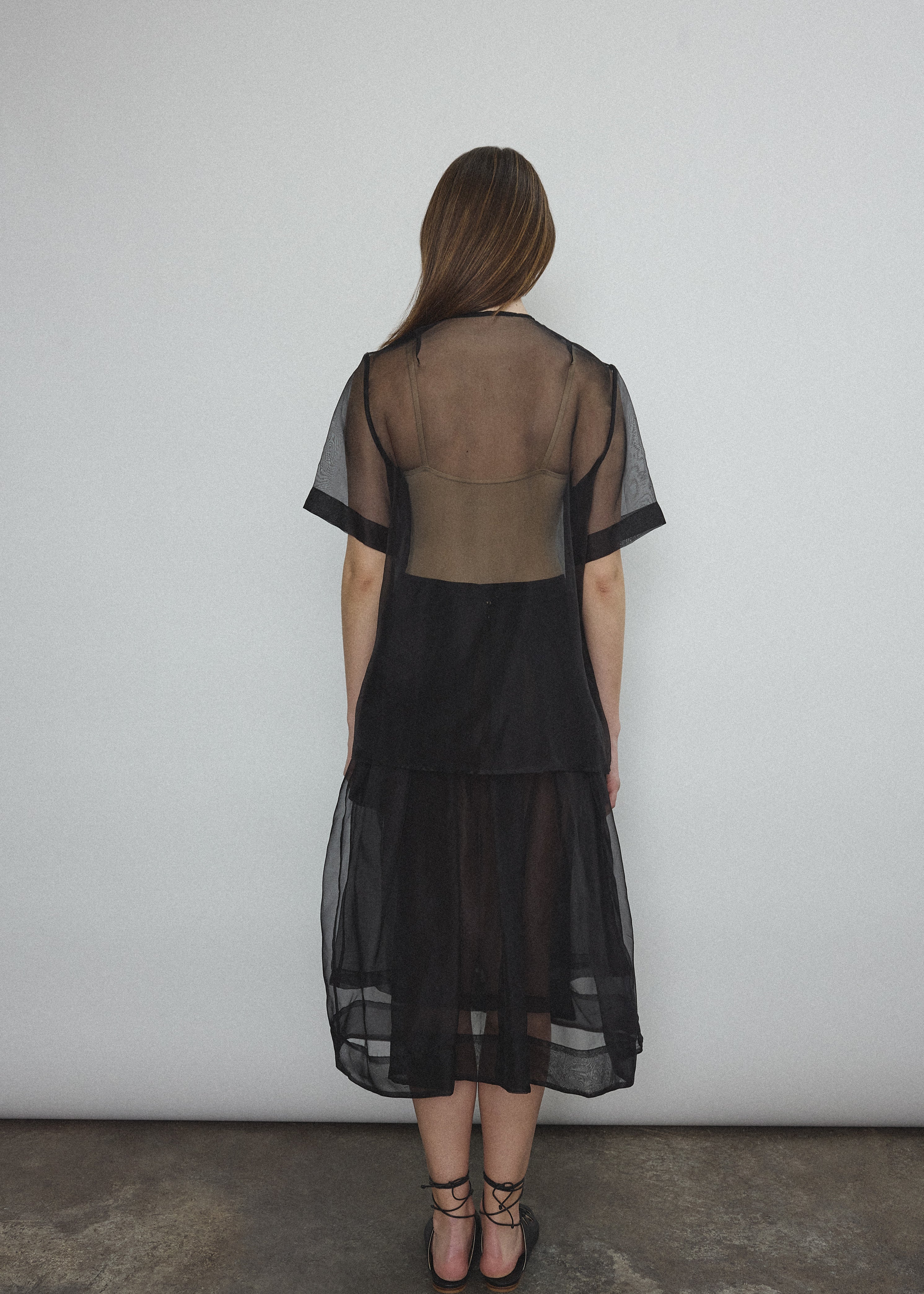Angled view of the black silk organza Kamperett Jette Tee.