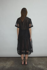 Back view of the black silk organza Kamperett Jette Tee showing the reversible shoulder darts.