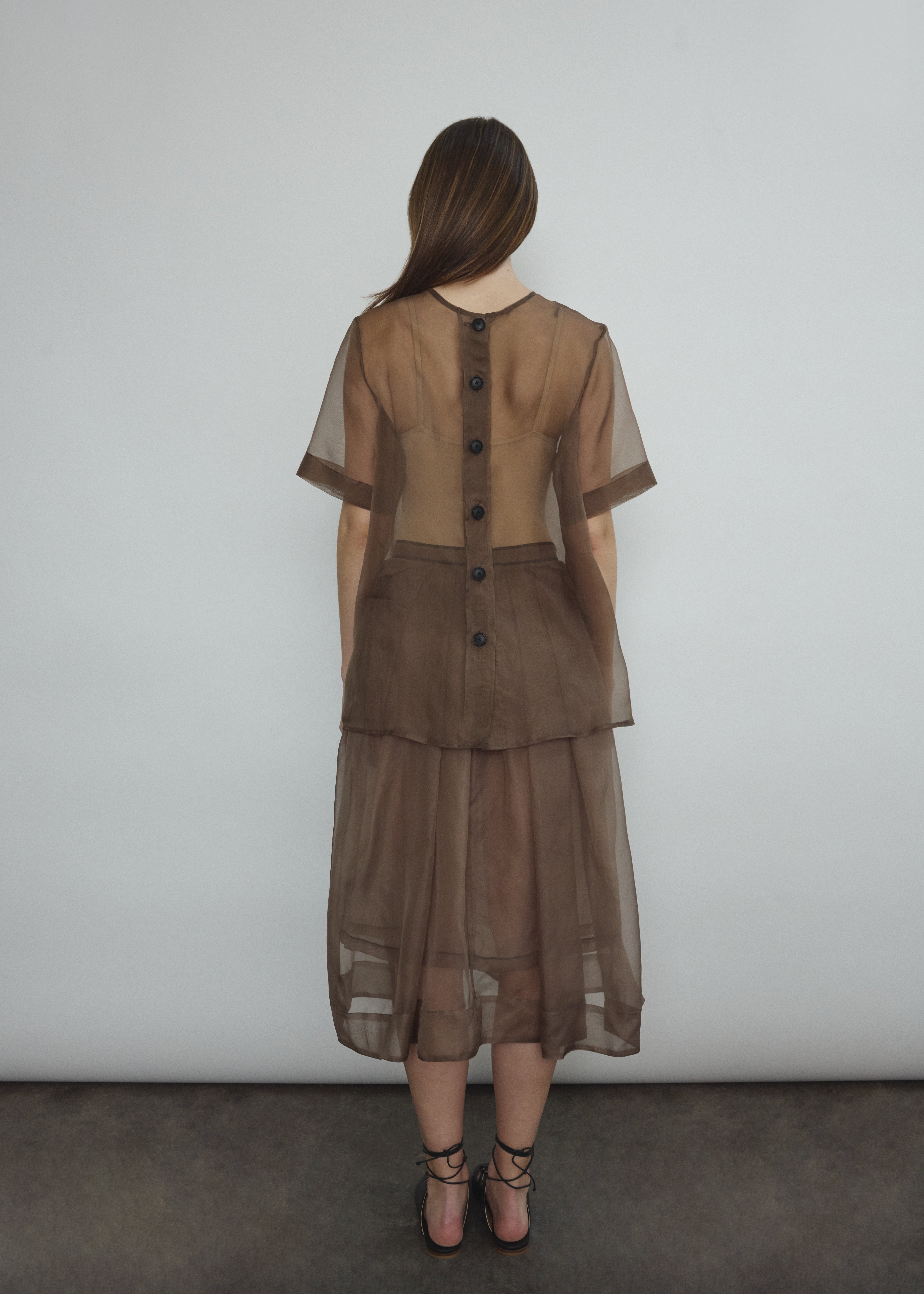 Angled view of the mushroom silk organza Kamperett Jette Tee.