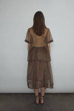 Side view of the mushroom silk organza Kamperett Jette Tee with sheer drape.