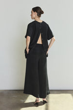 Model wearing the black Kamperett Jette Silk Crepe Tee styled with the Alix Silk Crepe Pant in Black.