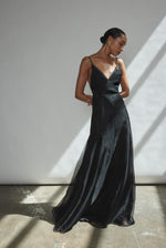 Angled view of the black silk organza Kamperett Lalique Gown with intricately seamed sheer construction.