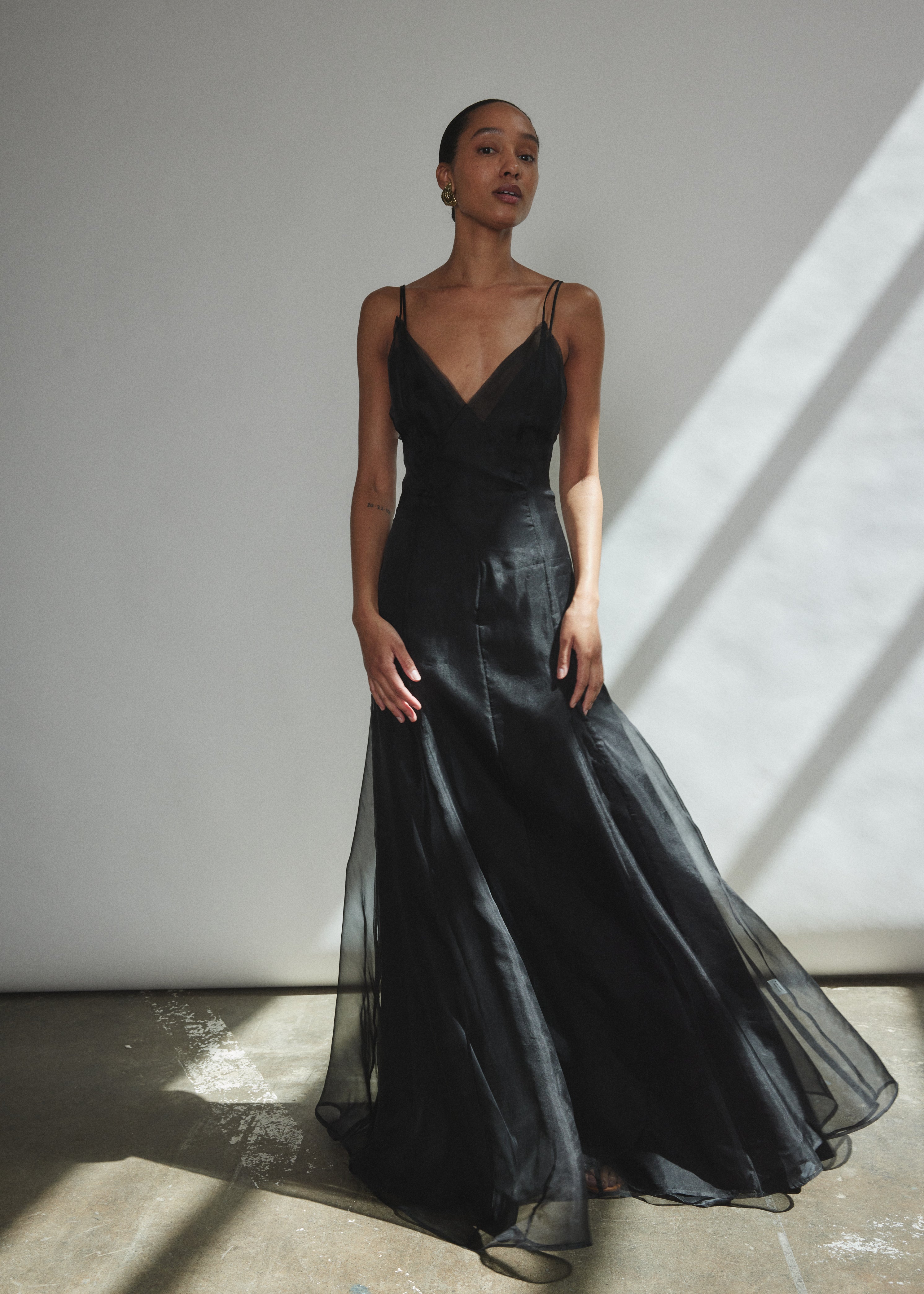 Detail of the V-neck and corded spaghetti straps on the black silk organza Kamperett Lalique Gown.