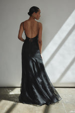 Model wearing the black Kamperett Lalique Gown layered over the Simone Slip Dress.
