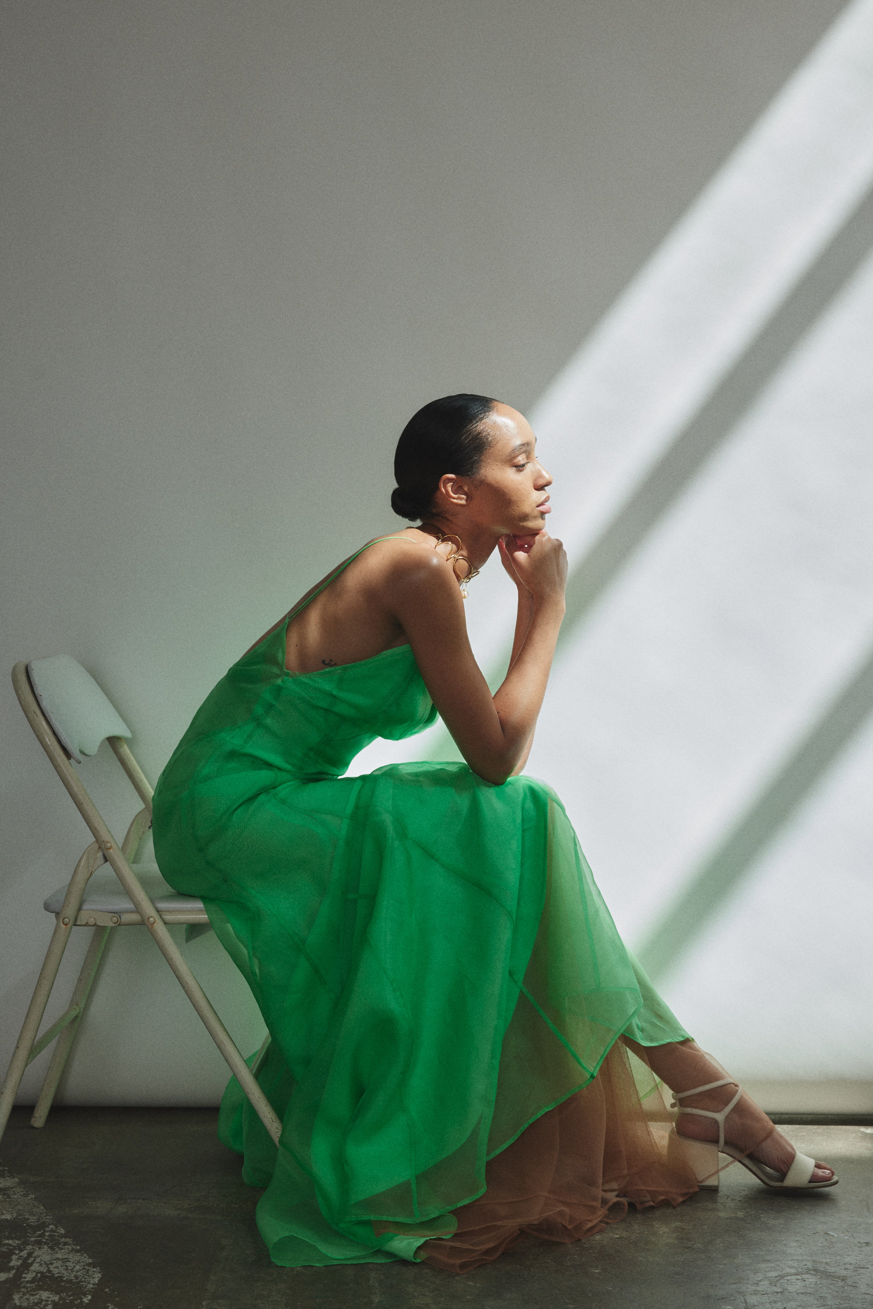 Detail of the V-neck and corded spaghetti straps on the celadon silk organza Kamperett Lalique Gown.