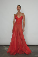 Side view of the vermilion silk organza Kamperett Lalique Gown with corded straps and sheer drape.