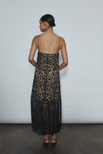Back view of the black cotton openwork Kamperett Lenore Dress with invisible center-back zip and spaghetti straps.