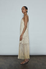 Back view of the cream cotton openwork Kamperett Lenore Dress with invisible center-back zip and spaghetti straps.