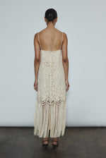 Editorial image of a bride wearing the cream Kamperett Lenore Dress, a modern bridal A-line midi with openwork motif.