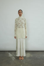 Back view of the ivory silk charmeuse Kamperett Leona Skirt showing the fluid bias-cut maxi length.