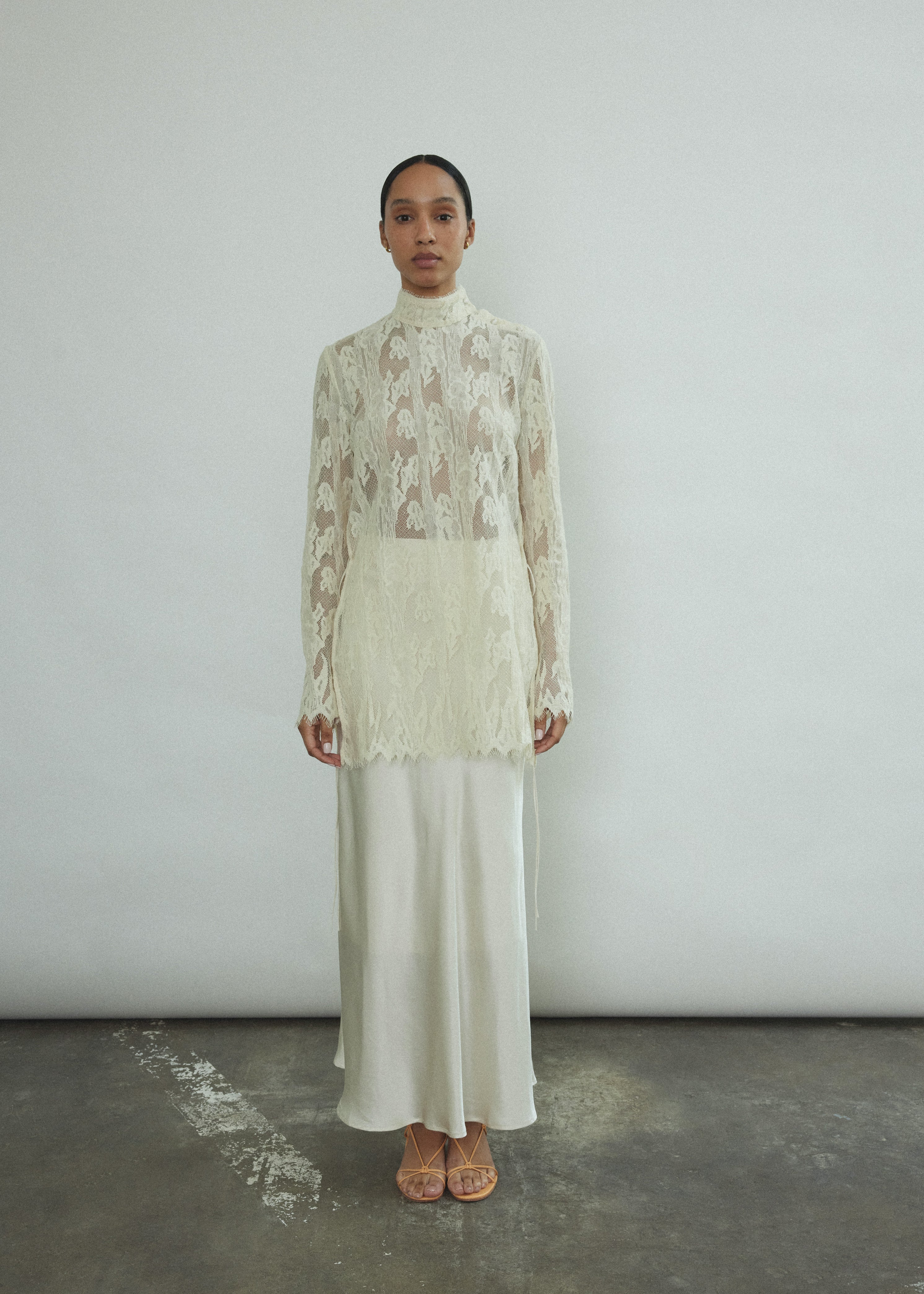 Back view of the ivory silk charmeuse Kamperett Leona Skirt showing the fluid bias-cut maxi length.