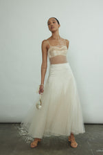 Styled view of the ivory silk charmeuse Kamperett Leona Skirt paired with the Isabella Tunic.