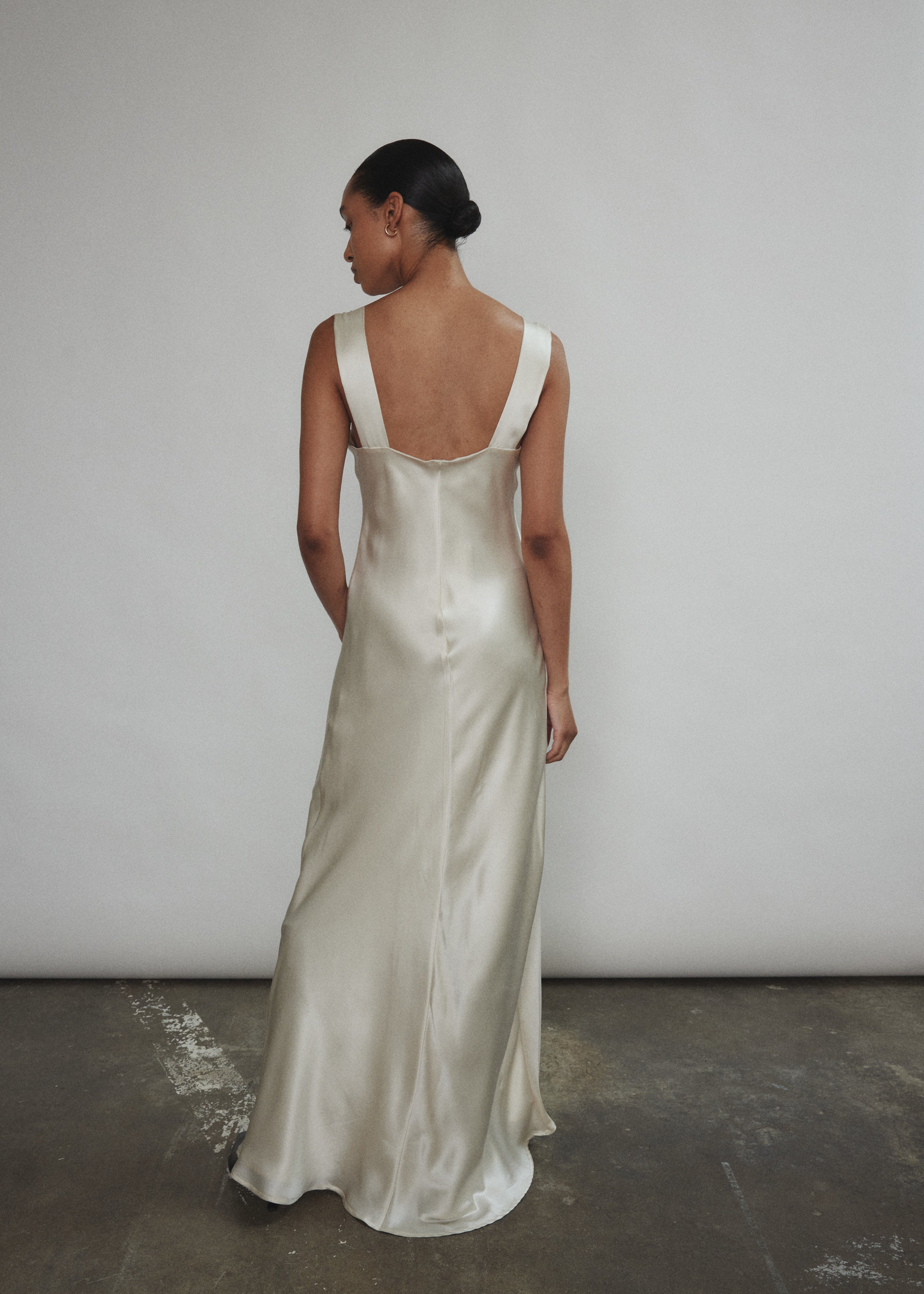 Back view of the ivory silk charmeuse Kamperett Lisette Maxi Slip Dress with wider strap detail.
