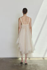 Back view of the ivory silk organza Kamperett Loie Dress with silk crepe straps and cord waist tie.