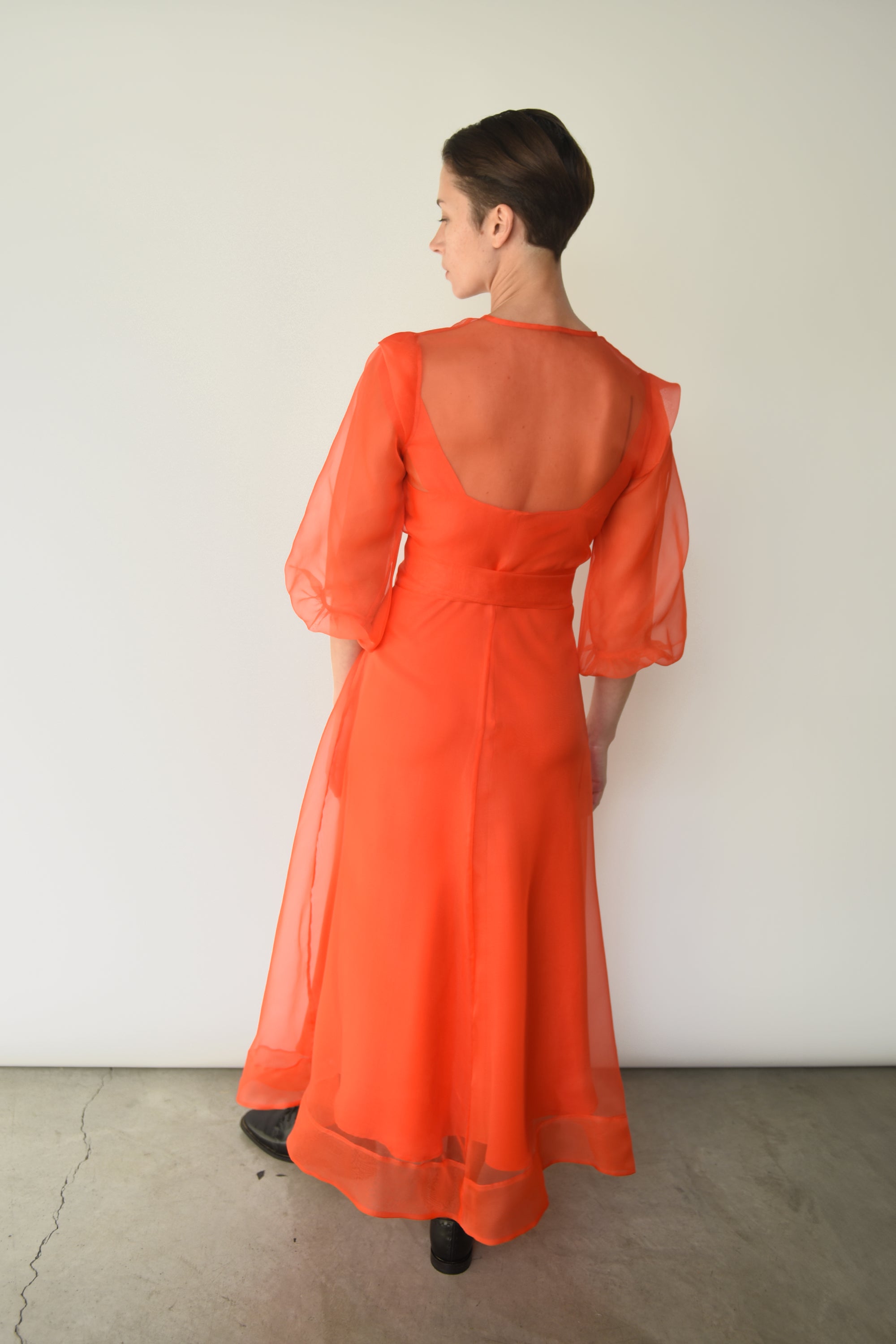 Back view of the vermilion silk organza Kamperett Loretta Midi Dress.