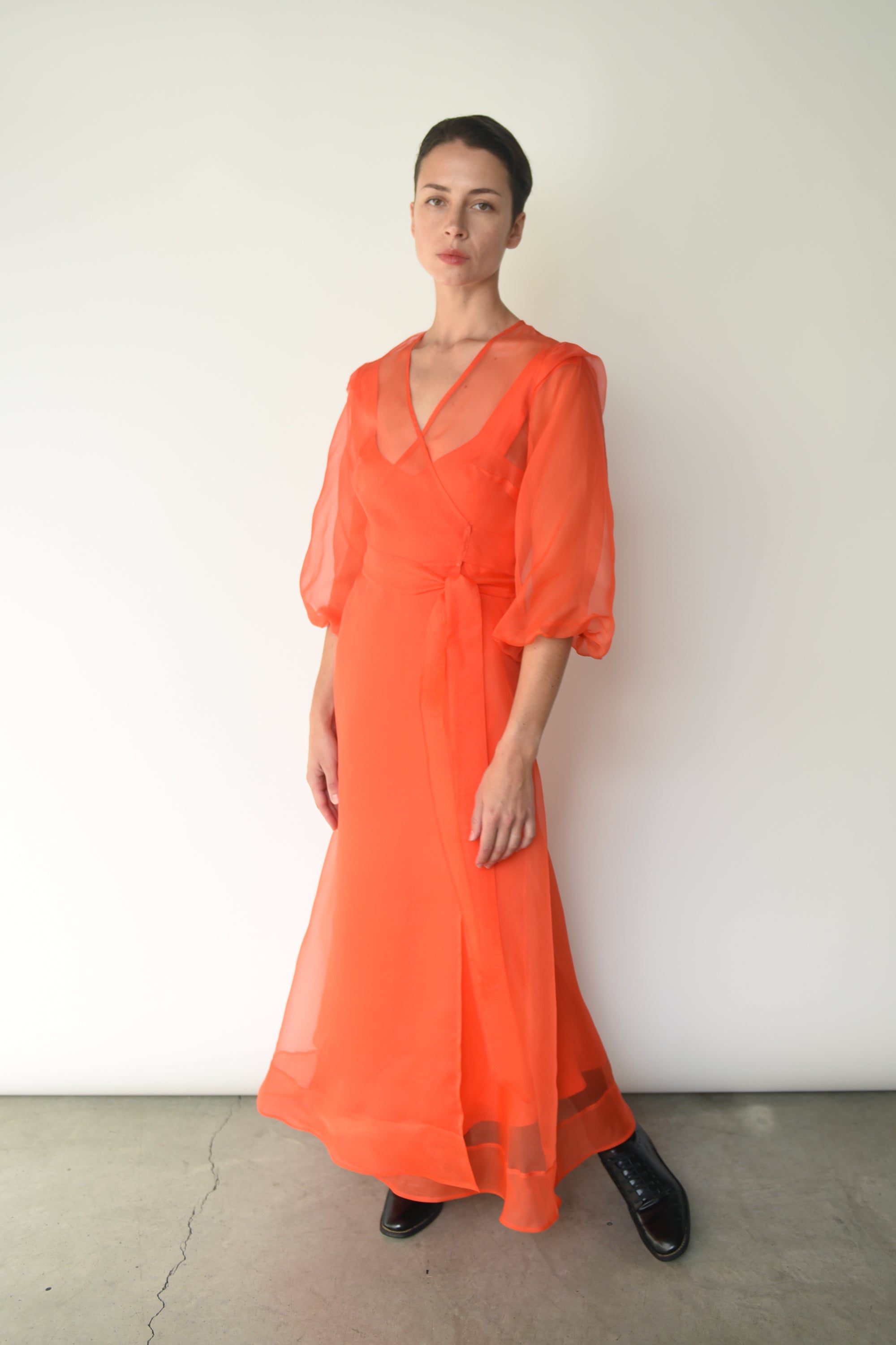 Editorial image of the vermilion silk organza Kamperett Loretta Midi Dress.