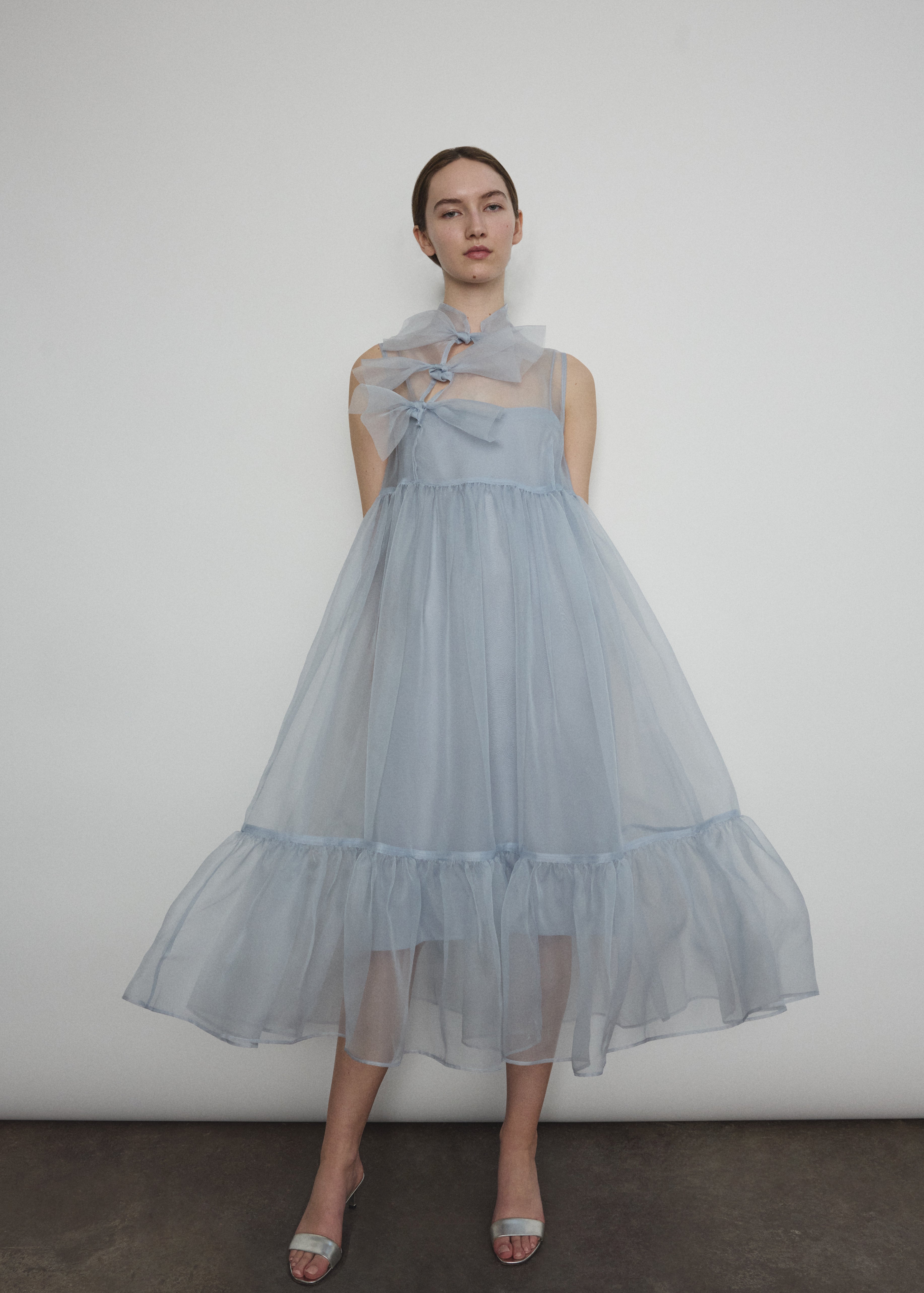 Angled view of the powder blue silk organza Kamperett Mae Dress.