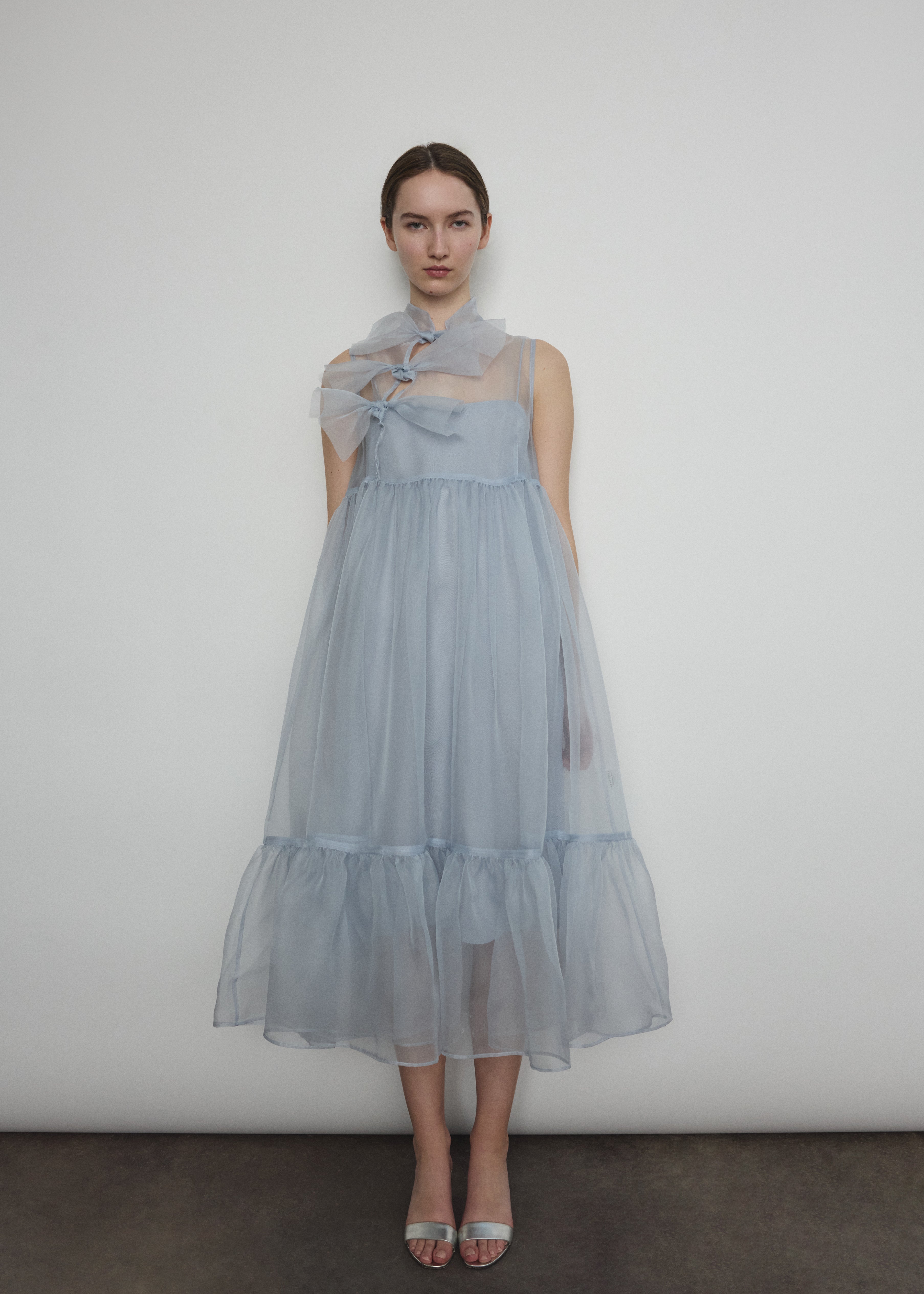 Back view of the powder blue silk organza Kamperett Mae Dress with empire waist seaming.