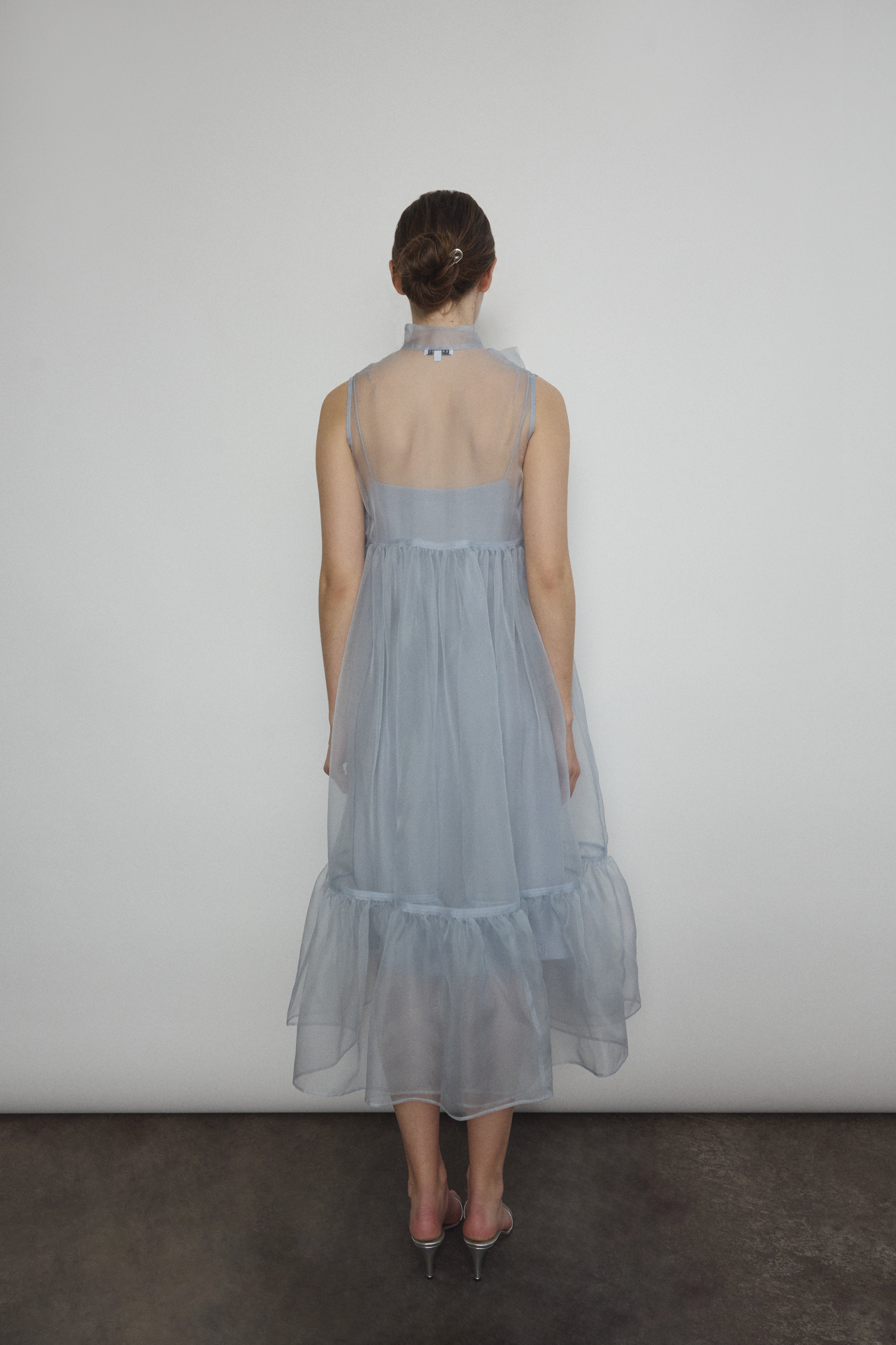 The powder blue Kamperett Mae Dress styled with the Short Slip underneath.