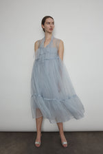 Detail of the qipao-inspired tie front closure on the powder blue silk organza Kamperett Mae Dress.