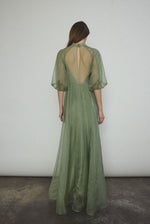 Angled view of the jade silk organza Kamperett Meiere Gown with fitted waist seaming.
