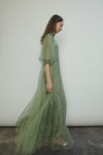 Editorial image of the jade silk organza Kamperett Meiere Gown.