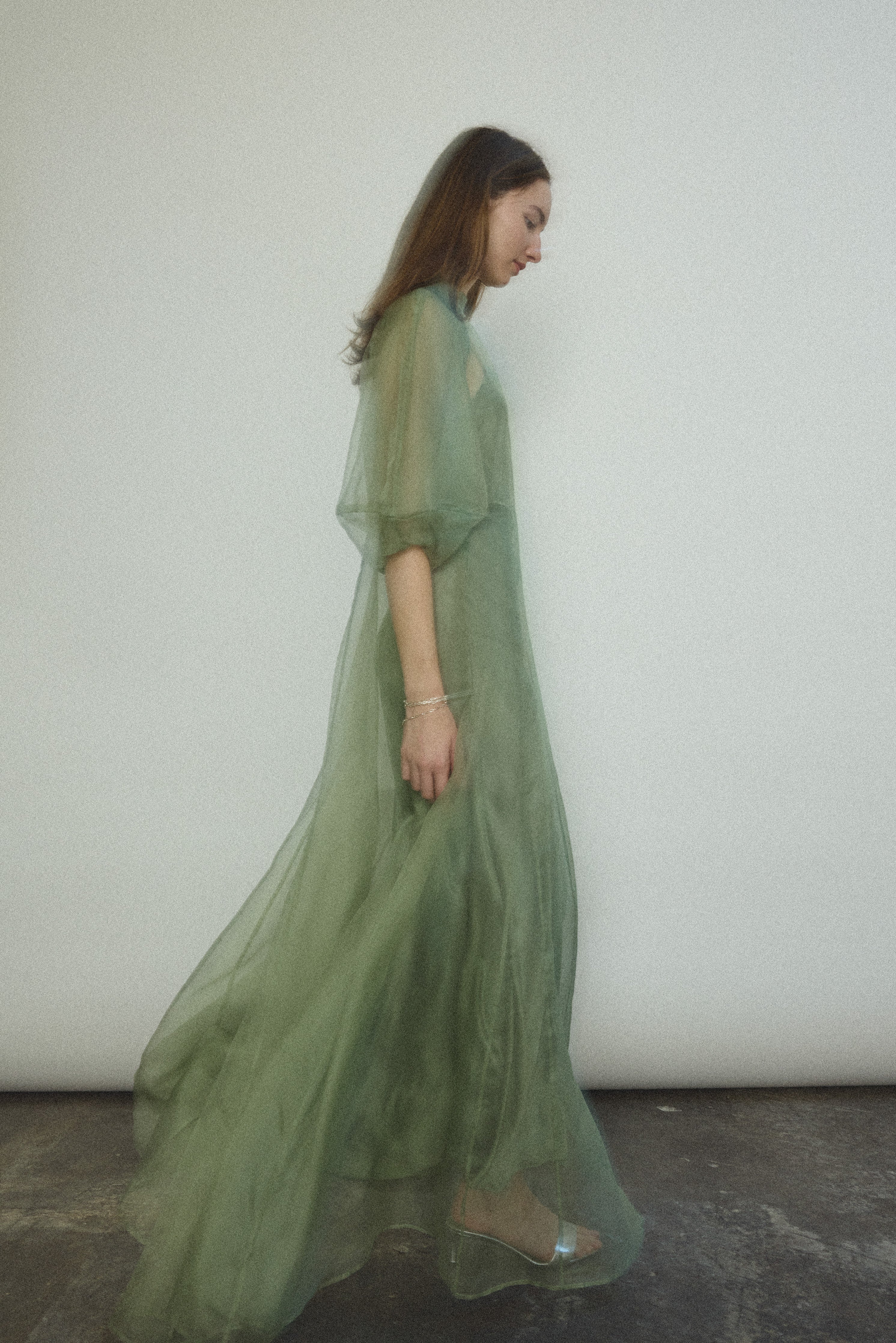 Editorial image of the jade silk organza Kamperett Meiere Gown.