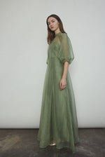 Side view of the jade silk organza Kamperett Meiere Gown showing the multi-godet skirt.
