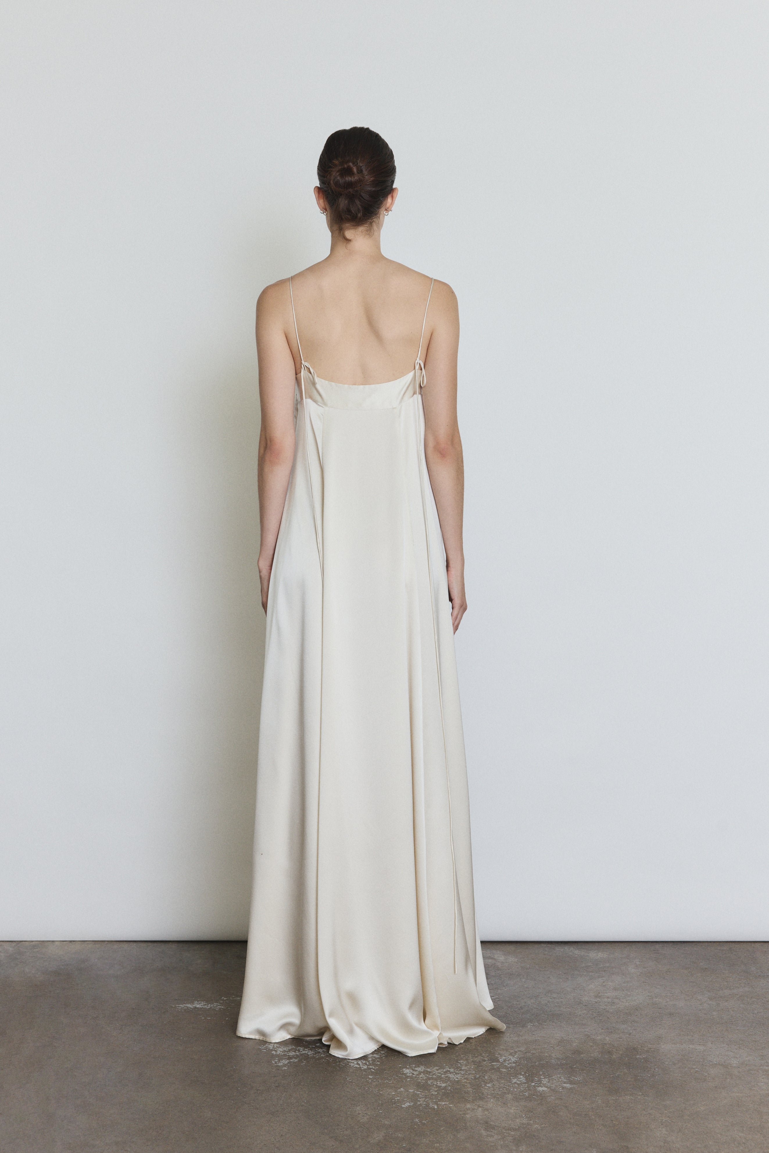 Back view of the ivory silk Kamperett Metronome Gown showing the corded straps.