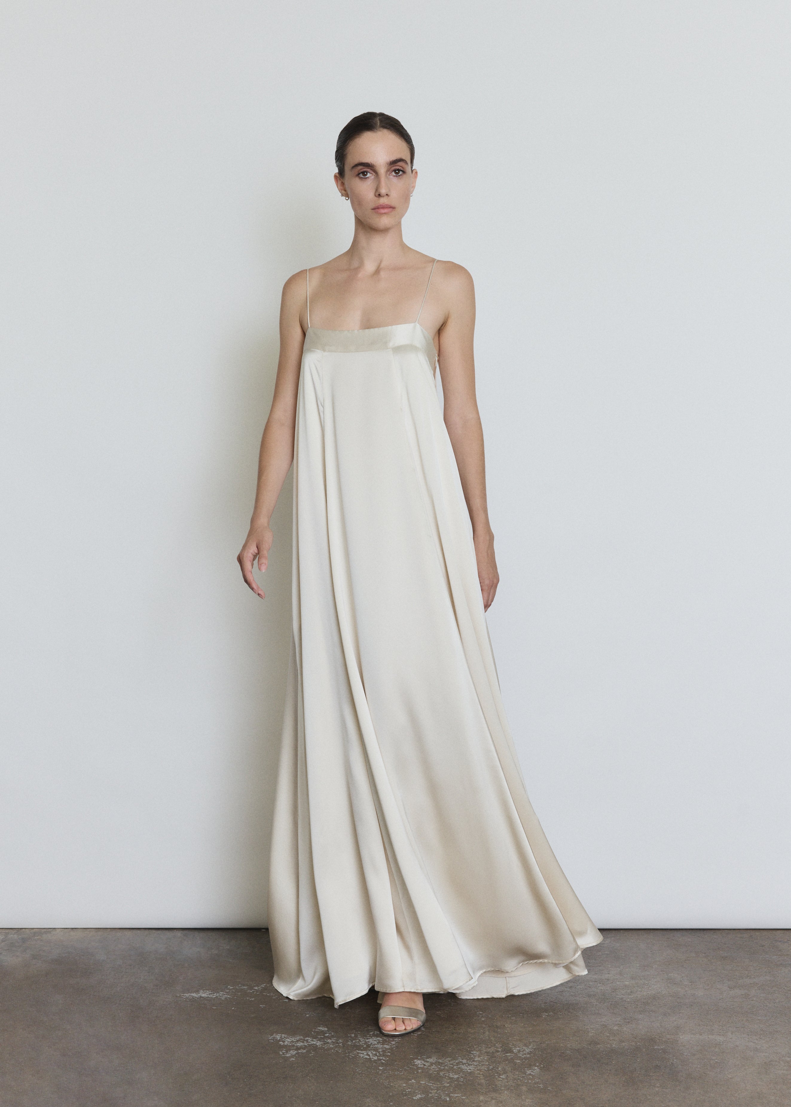 Detail of the ivory silk Kamperett Metronome Gown showing the fabric and in-seam pockets.