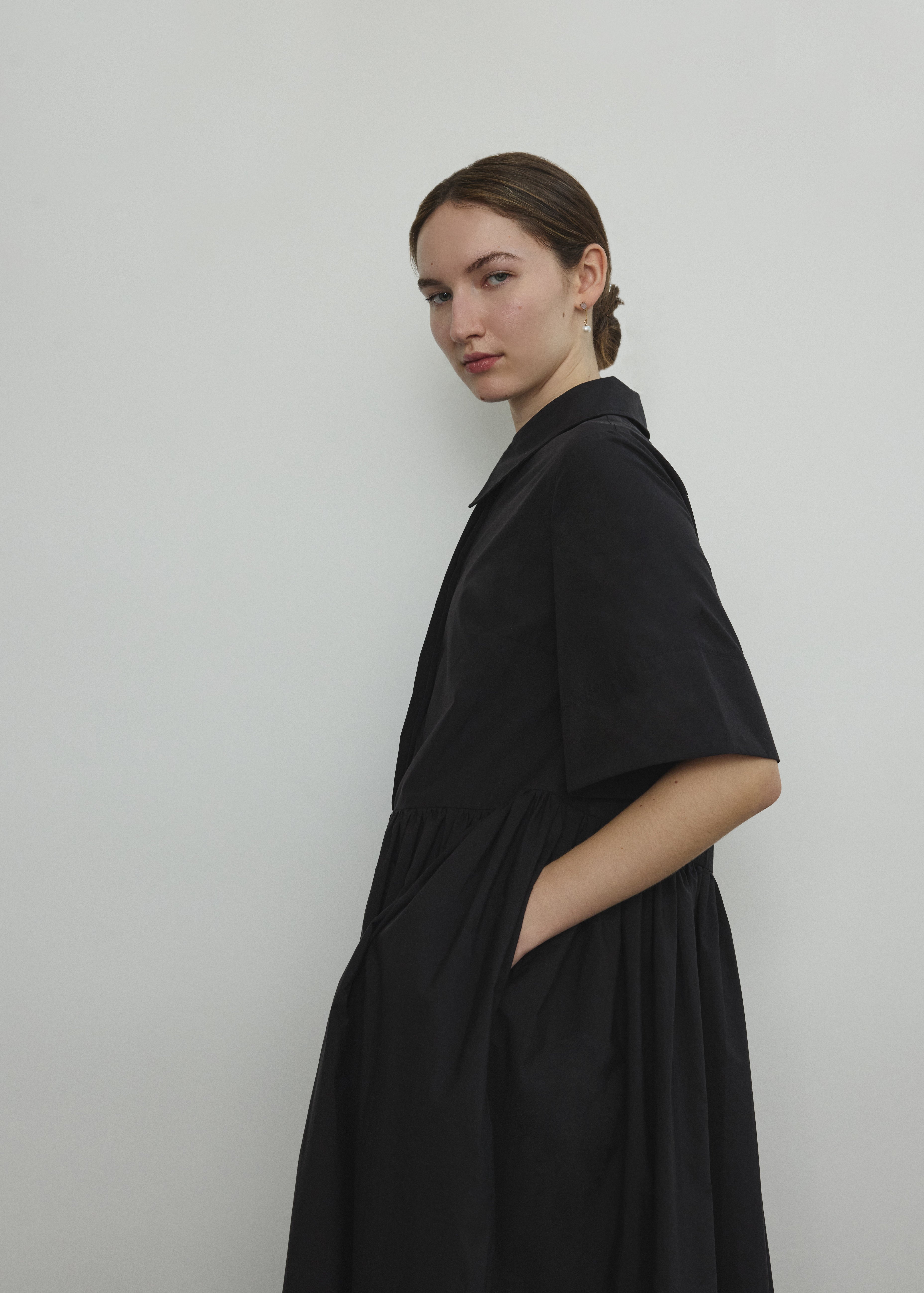 Back view of the black Japanese cotton lawn Kamperett Miller Dress showing the oversized shirt dress silhouette.