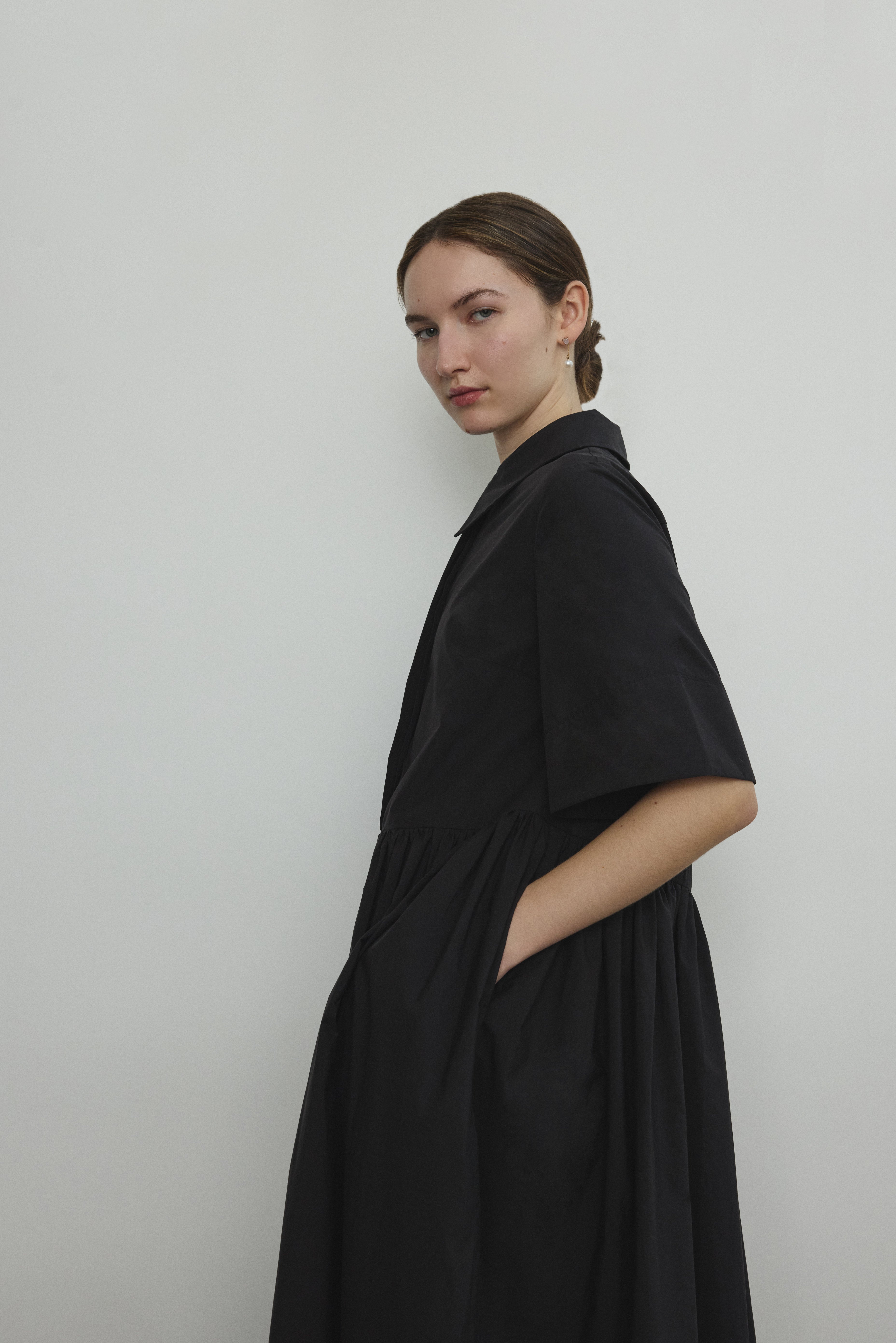 Back view of the black Japanese cotton lawn Kamperett Miller Dress showing the oversized shirt dress silhouette.