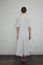 Side view of the white Japanese cotton lawn Kamperett Miller Dress with gathered waist and short sleeves.