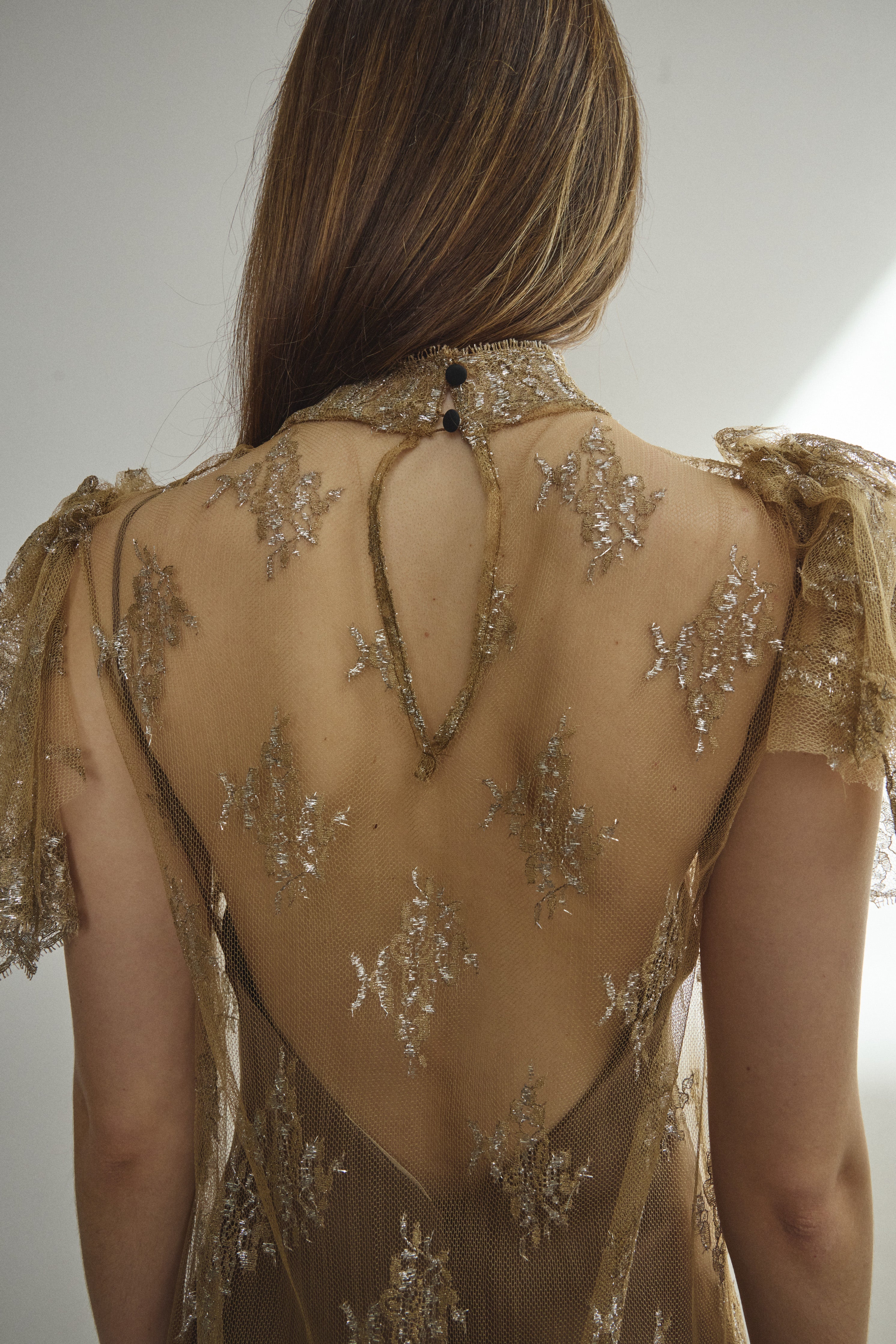 Rear view of Kamperett Moony Lace Gown — black silk button closure at center back neck, unlined French lace, clean straight-cut silhouette. Made in California.